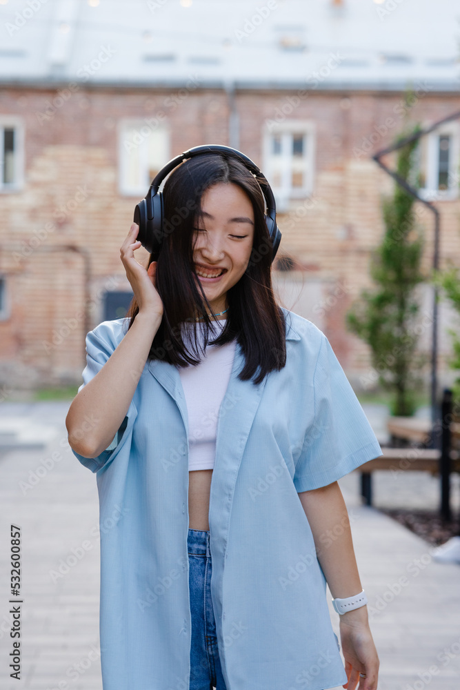 Girl enjoying music playlist during stroll Girl enjoying music playlist during stroll