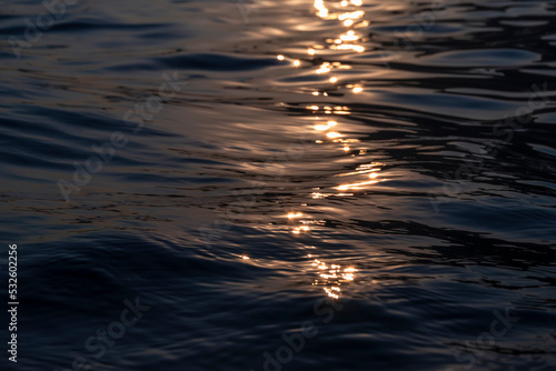 Water surface at sunset photo
