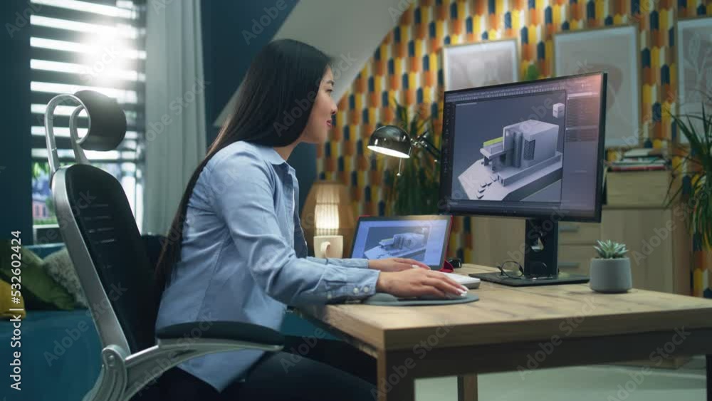 Female asian 3D designer at home working on 3D modeling project of house and making exterior in professional computer program using pc and digital tablet Female asian 3D designer at home working on 3D modeling project of house and making exterior in professional computer program using pc and digital tablet