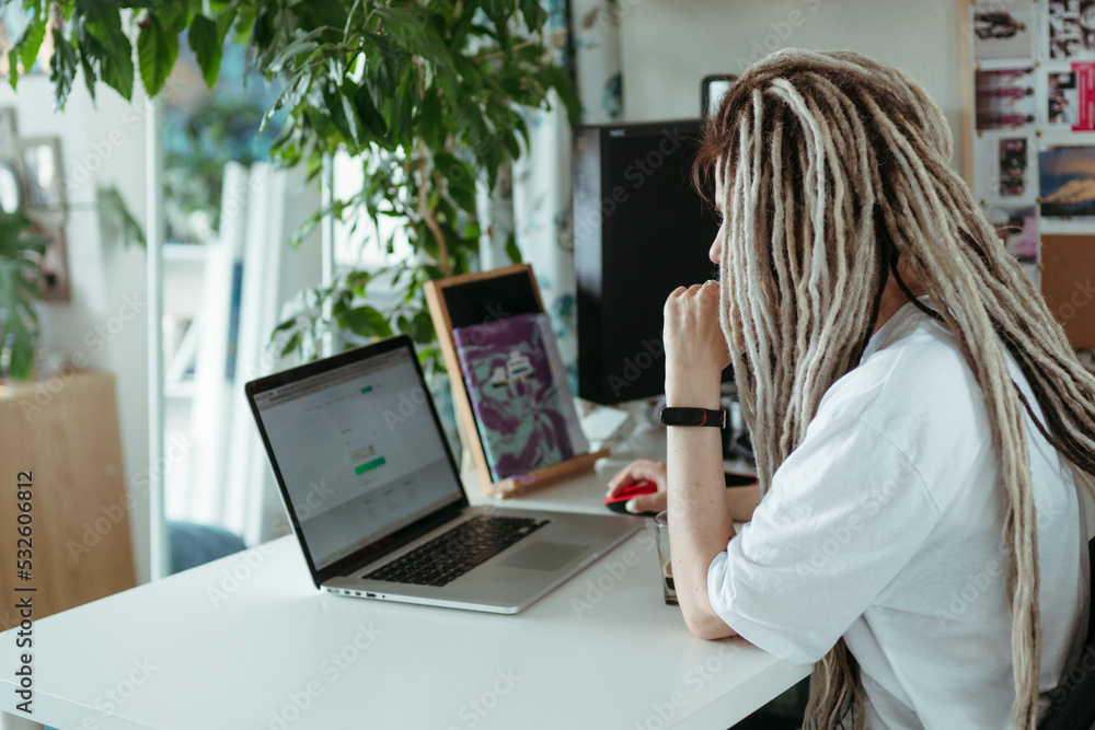 Faceless female using laptop. Faceless female using laptop.
