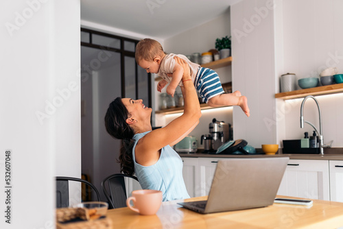 Mother playing with her baby