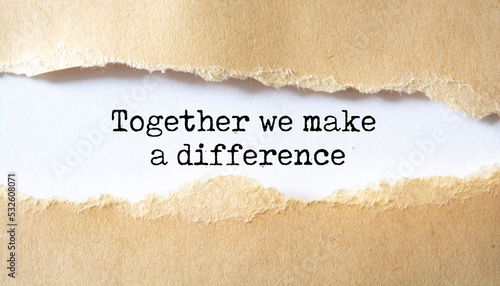 Together We Make A Difference appearing behind torn paper. Business concept
