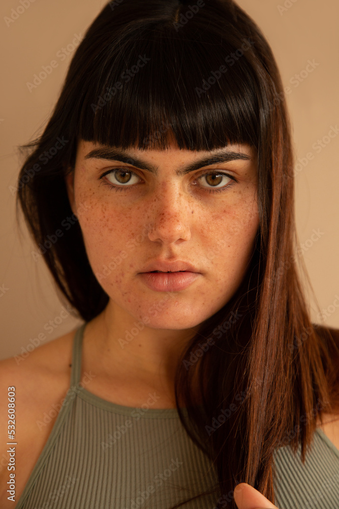 Woman with intense eyes looking at camera Woman with intense eyes looking at camera