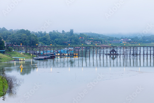 View of nature on the old wooden bridge in the morning in Thailand. © Sarin