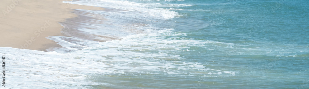 Fototapeta premium Sea waves blow on the sandy beach. for background