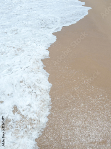 Sea waves blow on the sandy beach. for background