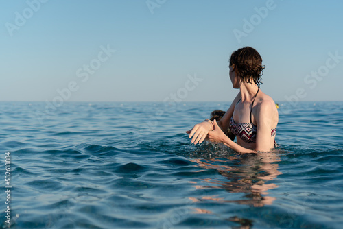 Woman saves man from the sea photo