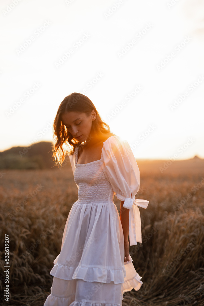 Girl in airy dress taking rest in nature Girl in airy dress taking rest in nature