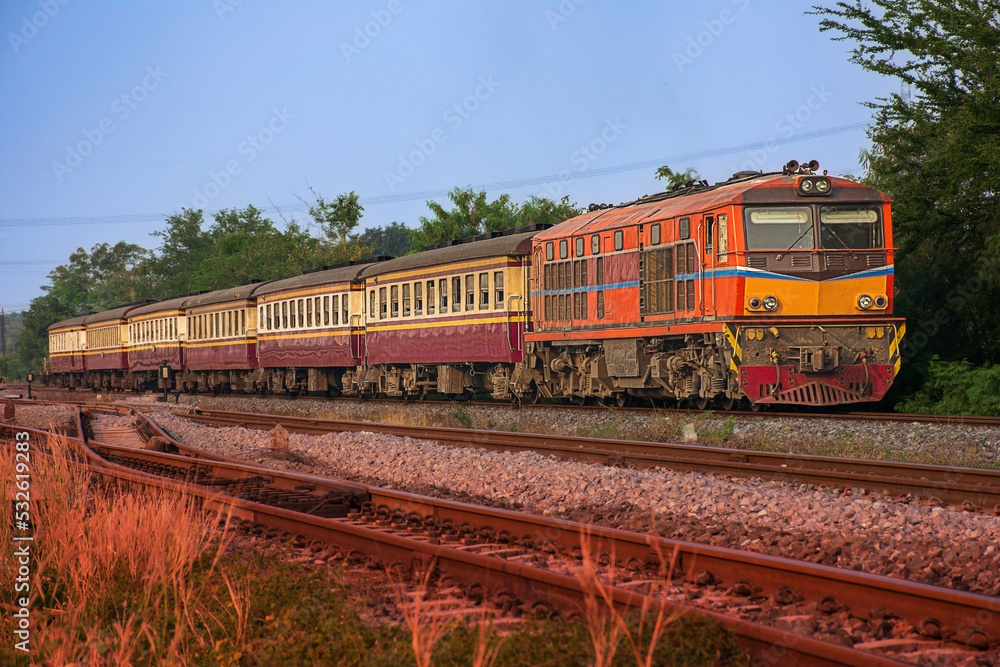 Passenger train by diesel locomotive on the railway. Passenger train by diesel locomotive on the railway.