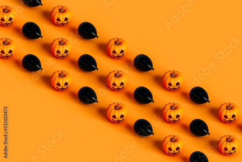 rows of Halloween pumpkin and black balloon photo