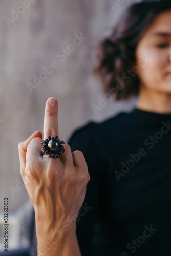 Crop woman showing fuck gesture
 photo