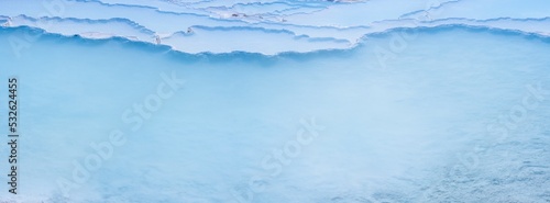 background of natural turquoise travertine pools and terraces in Pamukkale Turkey