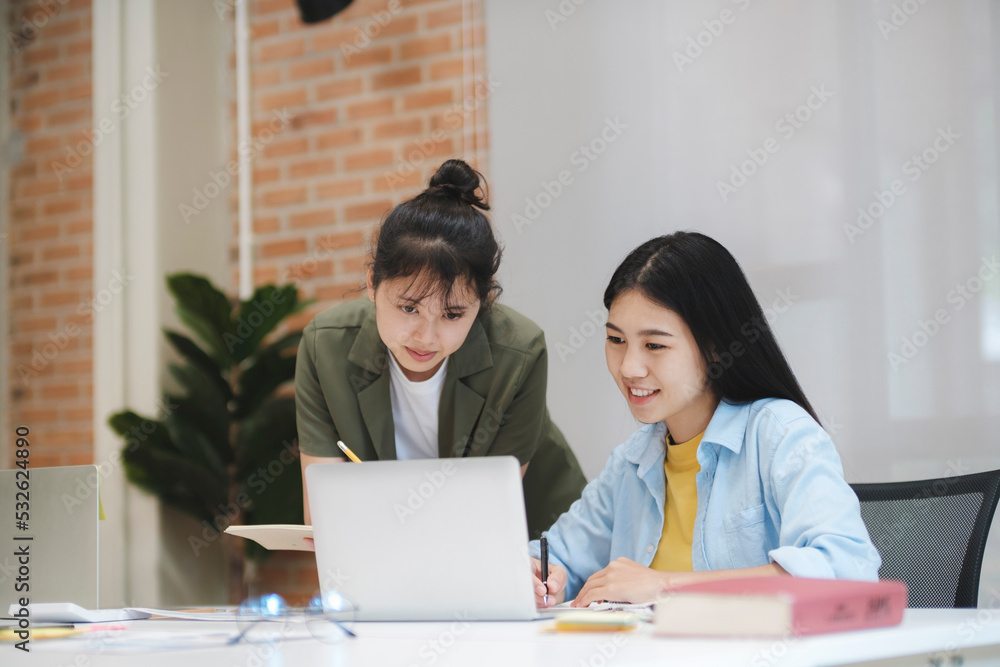 Young asian university students studying learning discuss working on computer. Young asian university students studying learning discuss working on computer.
