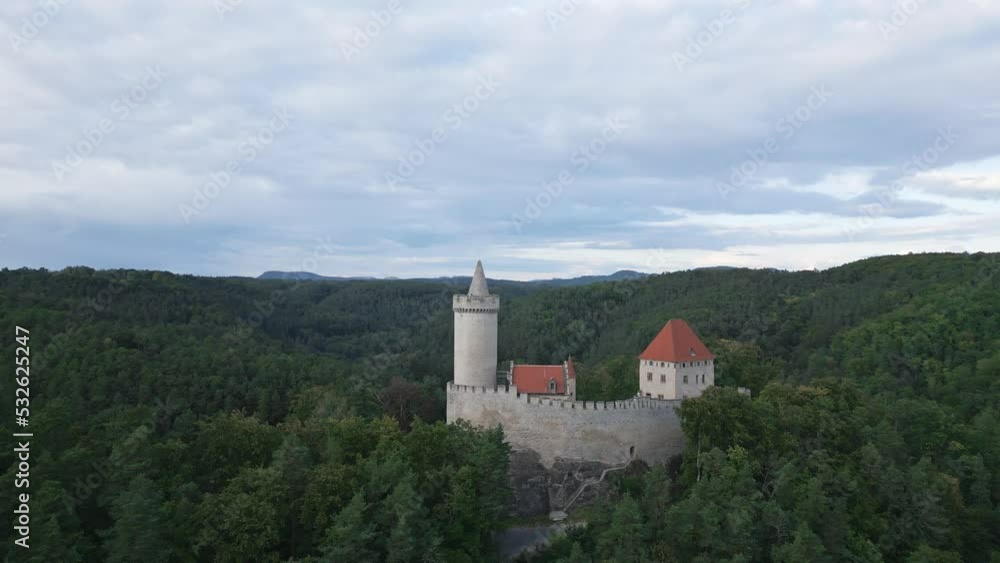 Medieval stone castle with a tower and high defensive walls. Kokorin, Czech republic Medieval stone castle with a tower and high defensive walls. Kokorin, Czech republic
