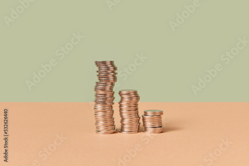 Stacks of cent coins on duotone background. photo