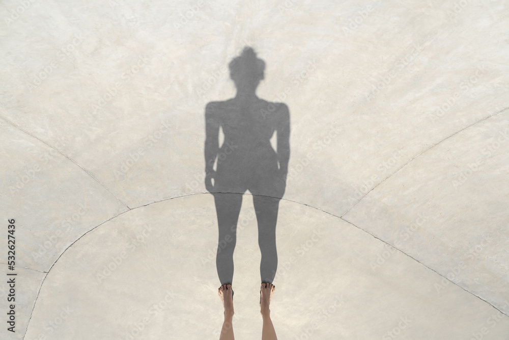Sportive girl is posing in outdoor skate park Sportive girl is posing in outdoor skate park