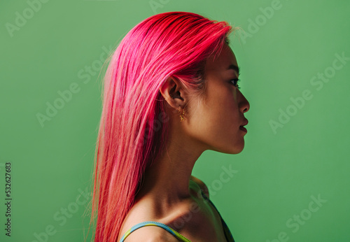 Portrait of chinese woman with pink hair photo