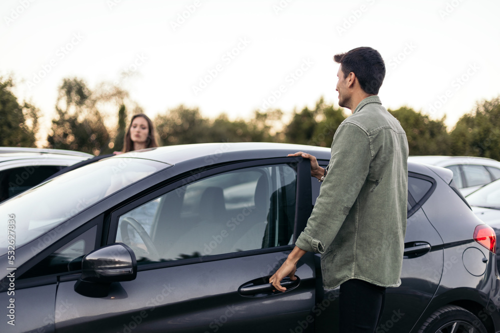 Couple getting into a car Couple getting into a car