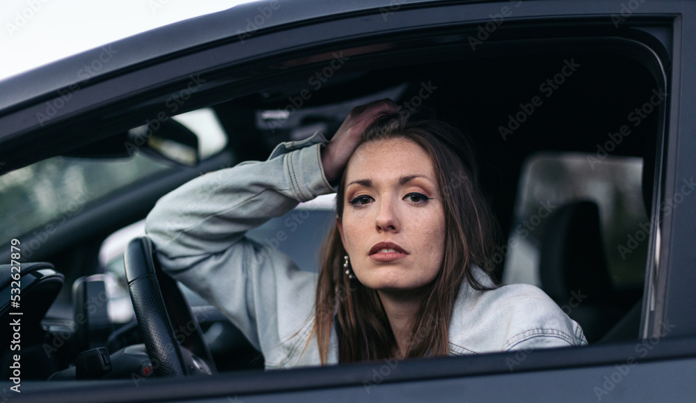 Portrait of a woman into the car Portrait of a woman into the car
