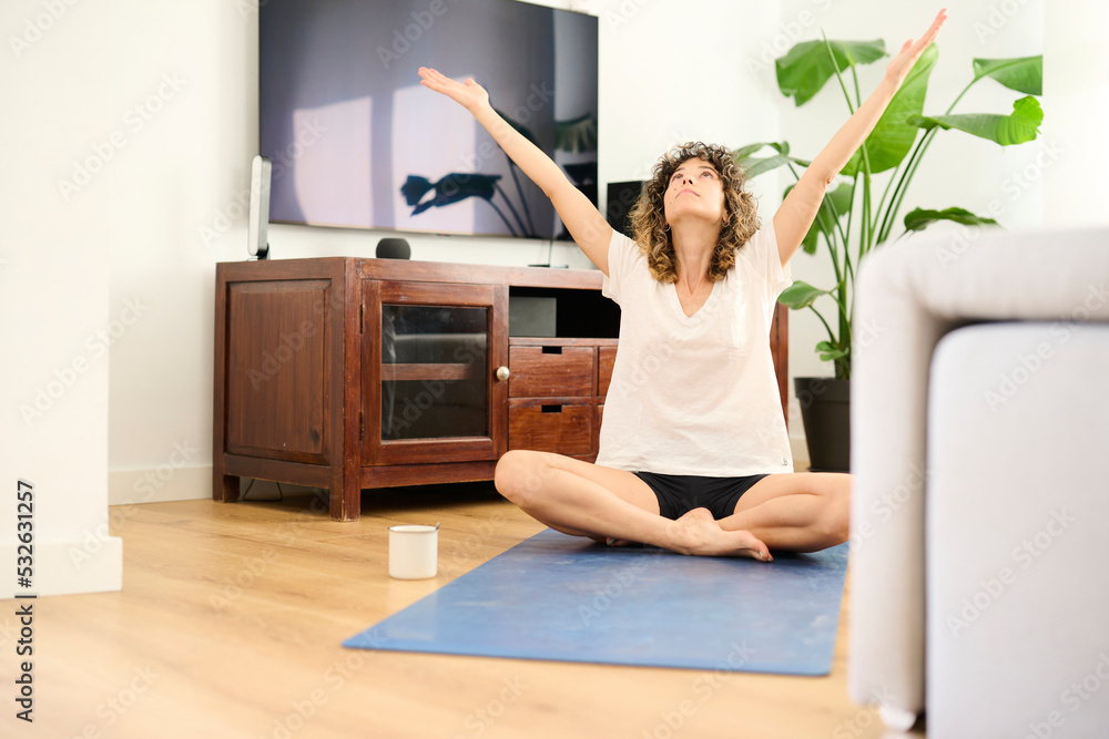 Woman meditating at home Woman meditating at home
