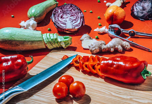 sliced veggies and knife on cutting board photo