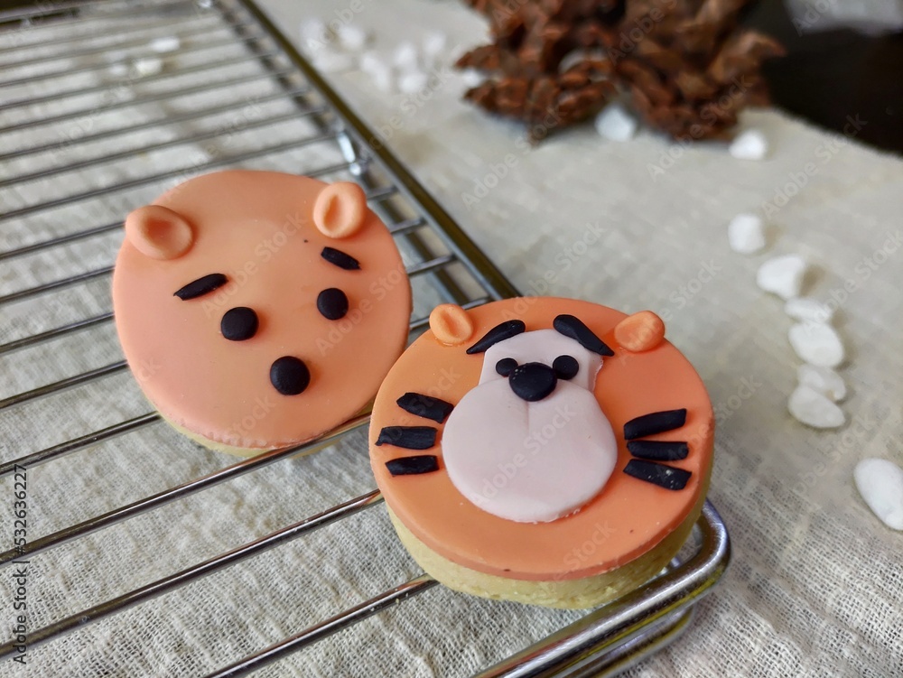 Cookies character orange lion on a grill Cookies character orange lion on a grill