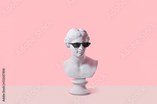 Venus gypsum bust in pixel glasses. photo
