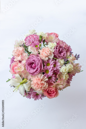 Beautiful bouquet of pink flowers arrangement roses in white background wallpaper decoration gift © Angie