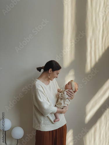 Young mother holding baby.  photo