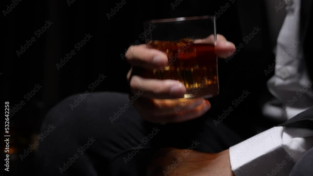 businessman holding whiskey, a restaurant businessman holding whiskey, a restaurant