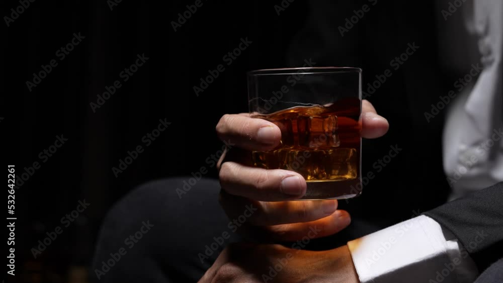 businessman holding whiskey, a restaurant businessman holding whiskey, a restaurant