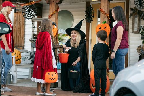 Shop Owner Witch Gives Halloween Candy To Kids