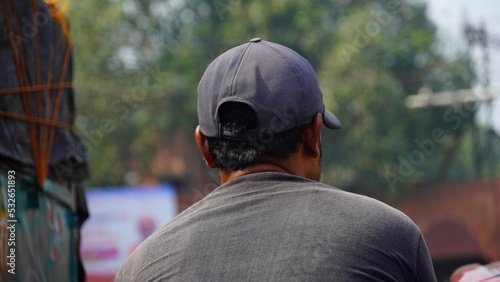 photo of a man wearing a cap from behind © FireFXStudio