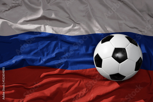 vintage football ball on the waveing national flag of russia background. 3D illustration