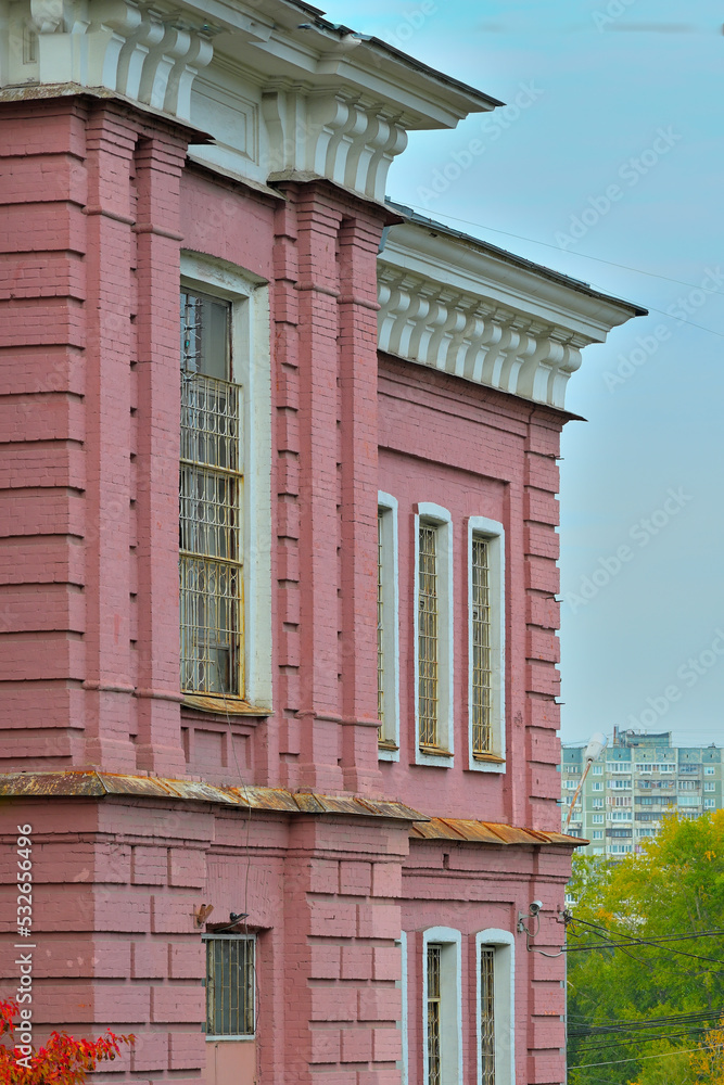 Fragment of the facade of a historic building on an autumn day