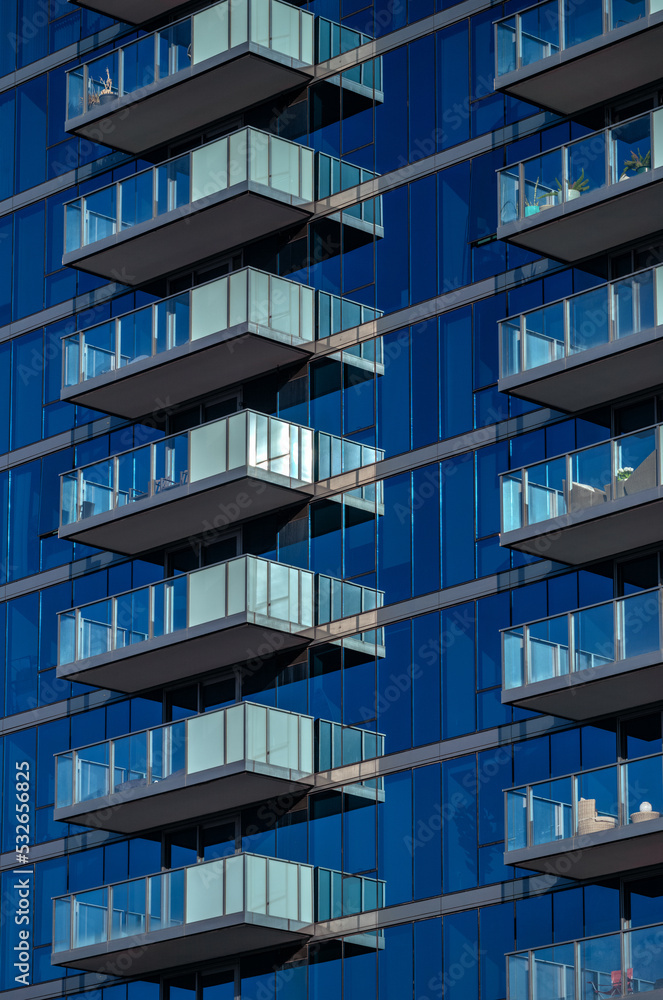 Obraz premium Blare Reflections on a Building Exterior.