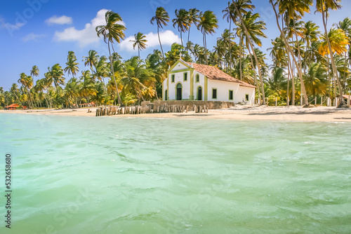 Carneiros idyllic beach with Chapel church at sunny day, in Northeastern Brazil