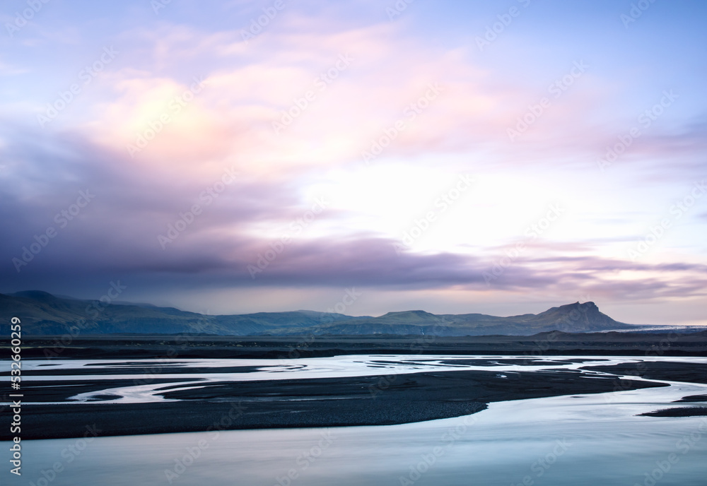 Glacier rivers in Iceland. Awesome sunset landscape with a colorful sky.