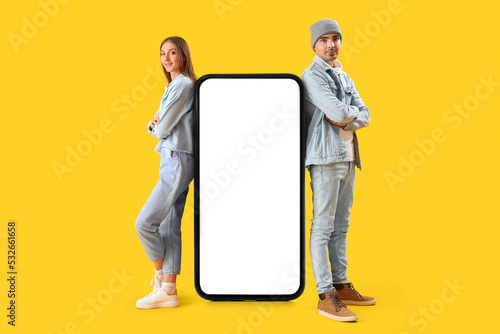 Young couple and big smartp...