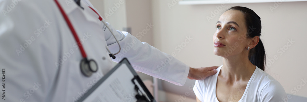 Doctor calms patient in clinic after medical examination