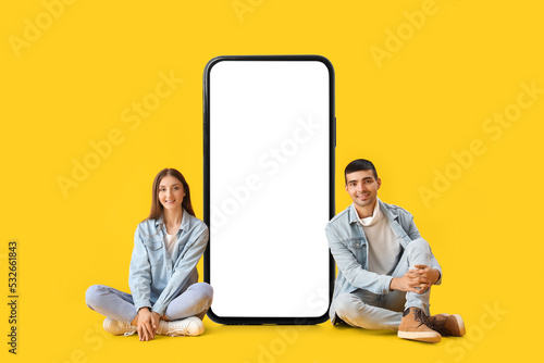 Young couple sitting near b...