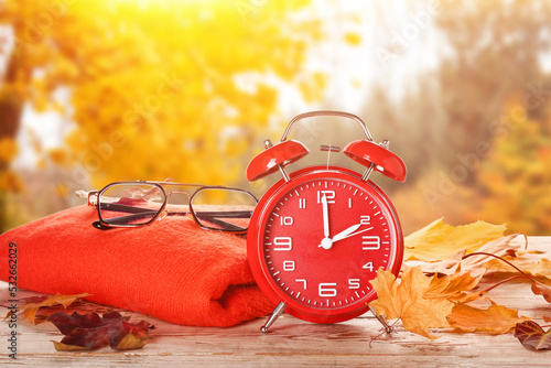 Alarm clock, sweater, glass...