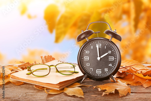 Alarm clock, notebook, glas...