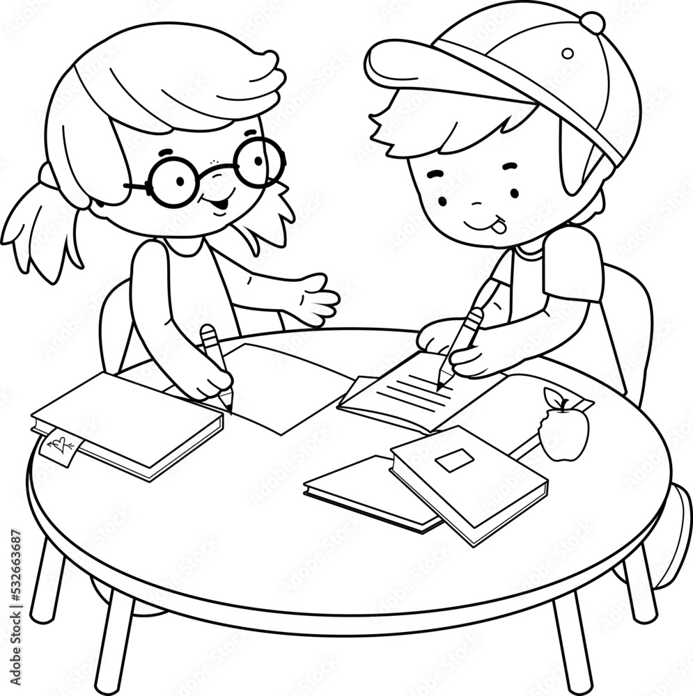 School children sitting at a desk at school doing their homework