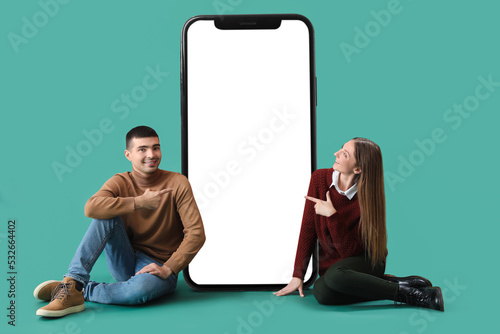 Young couple sitting near b...