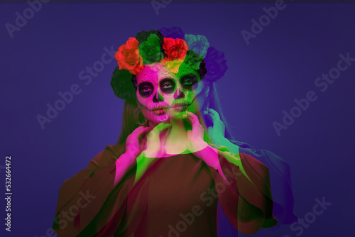 Young woman with painted sk...