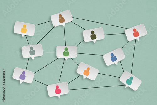 Concept of online communication or social networking. grunge white   speech bubbles paper cut with multi color people icon, linked to each other with lines