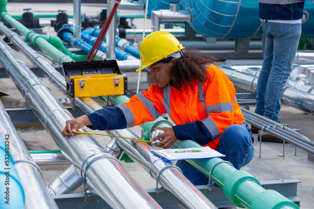 Engineer under industrial inspection Large water heaters are used in high-rise condominiums. Engineer under industrial inspection Large water heaters are used in high-rise condominiums.
