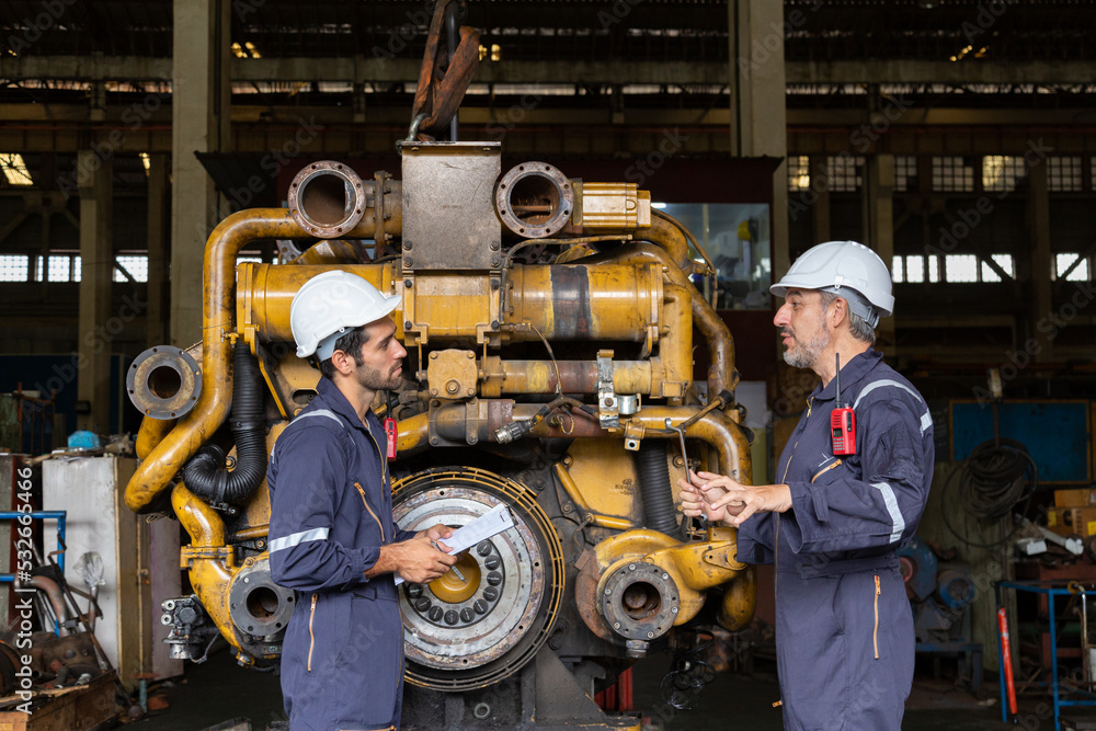 Engineer in the process of inspecting train engines Keep the machine ...
