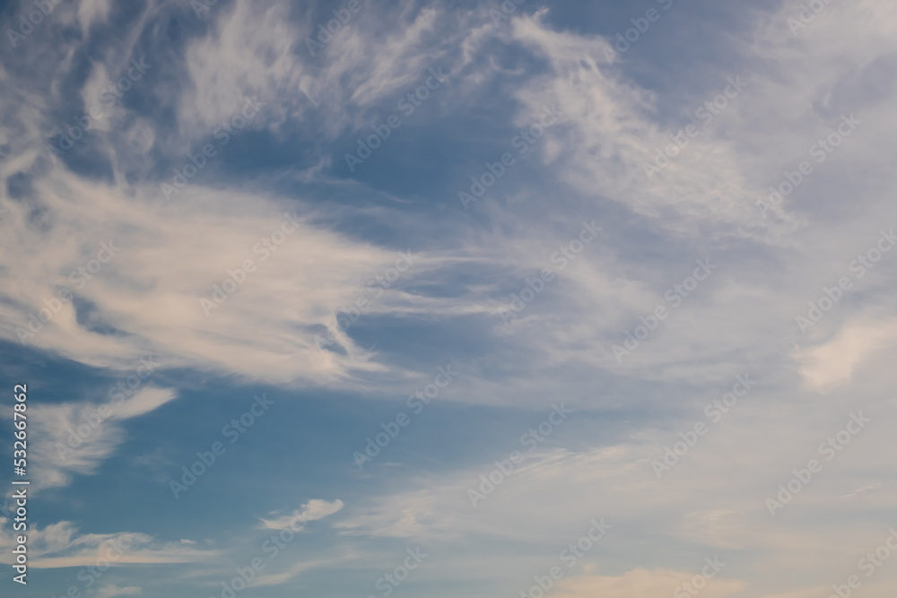 blue sky background with white striped clouds in heaven and infinity may use for sky replacement.